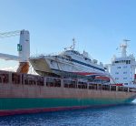 Boat being lifted onto ship